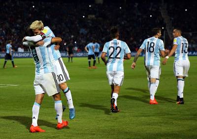 Argentina's Lionel Messi, second left, celebrates with Angel Di Maria (L) after scoring against Uruguay. Nicolas Aguilera / EPA