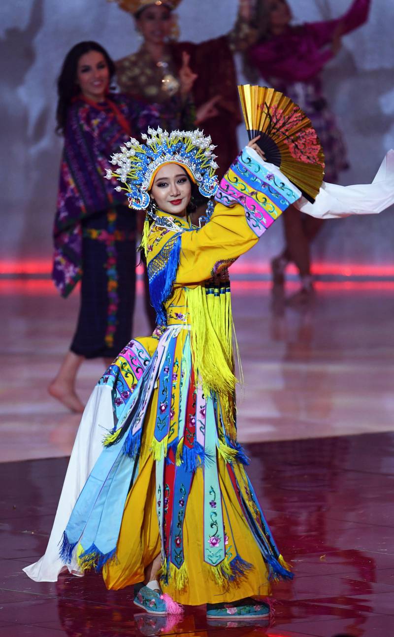 Miss China Li Peishan performs during the Miss World 2019 final in the ExCel centre in London. EPA