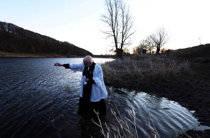 Reverend Rob Kelsey held the annual 'Blessing of the Salmon' service at Pedwell Landings in Norham, Northumberland, on Wednesday. Reuters