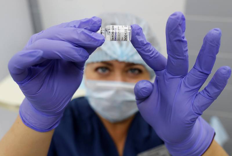 A medical worker holds a vial with Sputnik V vaccine during the vaccination against the coronavirus disease near Moscow, Russia. Reuters