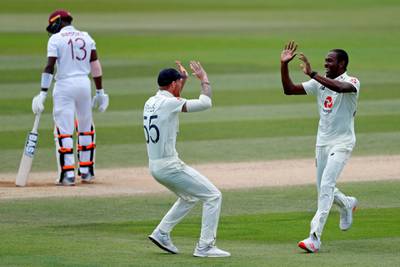 England's Jofra Archer, right, celebrates with Ben Stokes after dismissing West Indies batsman Shamarh Brooks for a duck. AFP