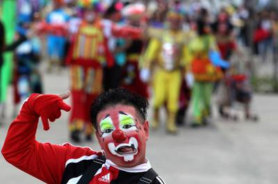 A clown gestures during the celebrations. AFP
