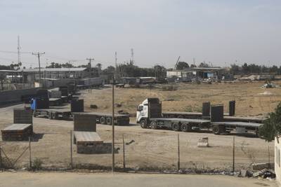 Palestinian lorries line up on the Gaza side of the border with Egypt to receive the aid. The Israeli blockade denied Gazans water, fuel and electricity as its military killed more than 4,000 Palestinians and displaced one million. AP