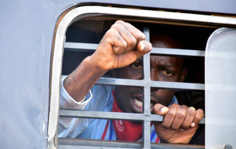 Bobi Wine reacts from inside a police van, in Luuka district, eastern Uganda on November 18, 2020. Reuters