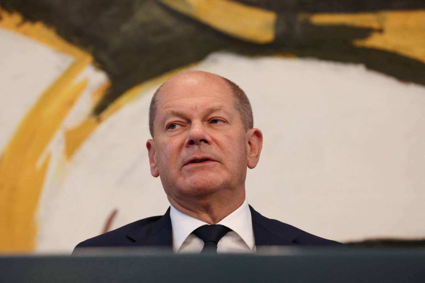 German Chancellor Olaf Scholz addresses the media on Sunday. Reuters