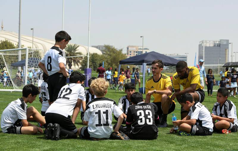 Abu Dhabi, United Arab Emirates - Juventus (white/black) vs. ESG Football Academy from Oman (green) under 12 age group on Abu Dhabi World Cup Day 1 at Zayed Sports City. Khushnum Bhandari for The National
