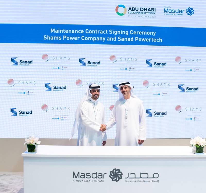 Mansoor Janahi, chief executive of Sanad Powertech, and Majed Al Awadi, general manager of Shams Power Company sign a maintenance deal. The contract marks the first collaboration between Mubadala's power generation companies. Photo: courtesy of Sanad
