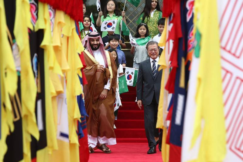 South Korean President Moon Jae-In, right, and Saudi Crown Prince Mohammed bin Salman walk to view an honour guard during a welcoming ceremony at the presidential Blue House. Getty