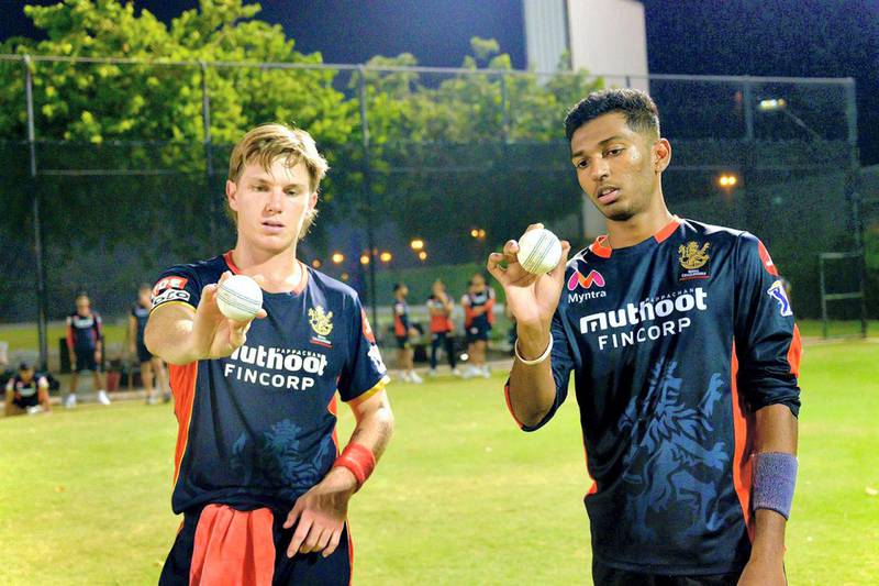 Adam Zampa and Karthik Meiyappan discuss leg-spin bowling at training in the IPL. Courtesy of Royal Challengers Bangalore