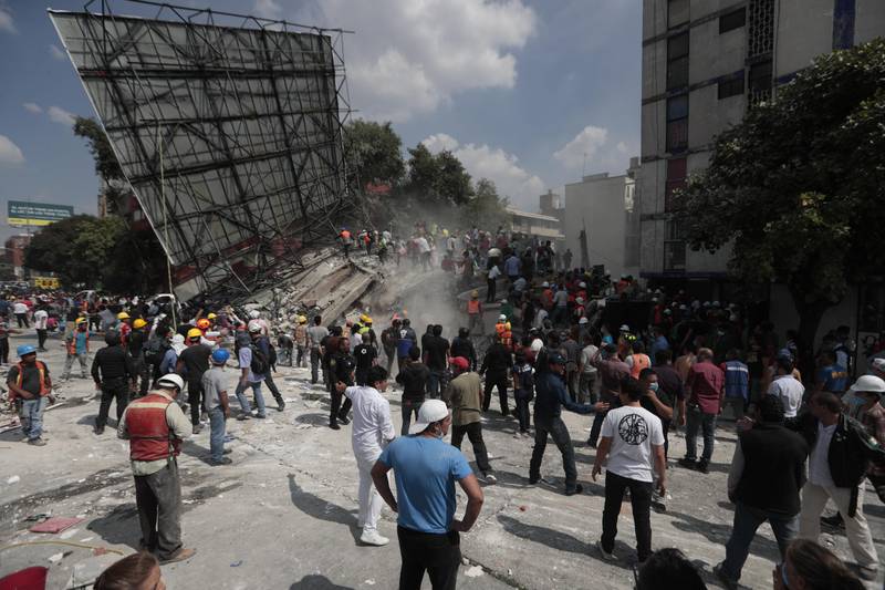 Rescue workers and volunteers search a building that collapsed after an earthquake in the Roma neighbourhood of Mexico City. Eduardo Verdugo / AP Photo