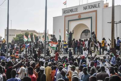 Supporters of Niger's junta gather in front of the National Assembly in Niamey on Sunday. AFP