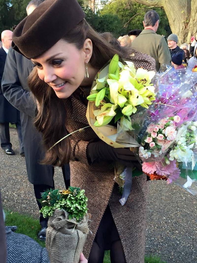 The photographs form part of the Historic Royal Palaces’ 'Life through a Royal Lens' exhibition. One of the photographs on display is this photograph of Catherine, Duchess of Cambridge, receiving a posy of flowers after the Sandringham Christmas service, taken by Amy from London.
