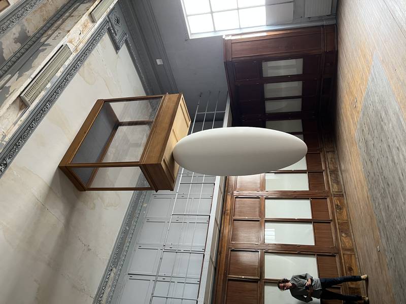 Palestinian-Swedish artist Tarik Kiswanson asked what it would be like to stand underneath the past. He drilled the Musee Guimet galleries' vitrines and desks into the ceiling, placing futuristic egg-like sculptures beneath them. Melissa Gronlund / The National 