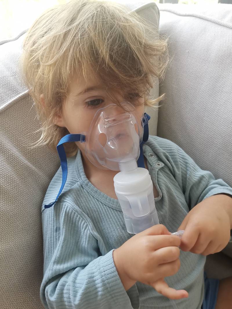 Ivy, 2, regularly uses a nebuliser since coughs are commonplace in the writer Katy Gillett's household. Katy Gillett / The National