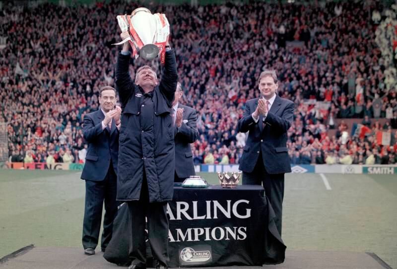 Alex Ferguson holds the Premier League trophy after the final home game of the 1996-97 season, which they won with 75 points. Getty