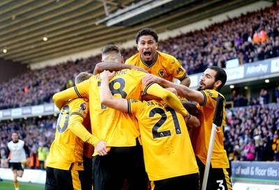 Wolverhampton Wanderers' players celebrate Pablo Sarabia's equalier. PA