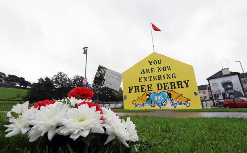 A floral tribute in memory of John Hume is pictured at the Free Derry Corner in Derry. Reuters