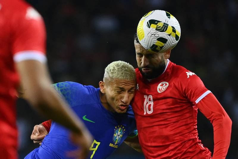 Brazil forward Richarlison and Tunisia midfielder Ghailene Chaalali fight for the ball. AFP