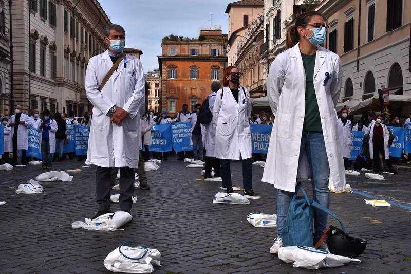 Emergency room staff protest against staffing shortage issues and the management of the Italian National Health Service during the Covid-19 pandemic, in central Rome. AFP