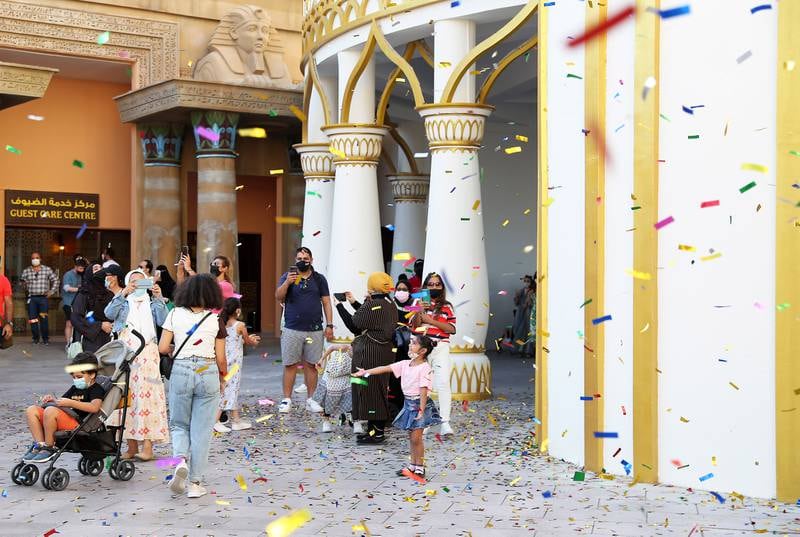 A confetti blast signals the opening of Global Village's 26th year.