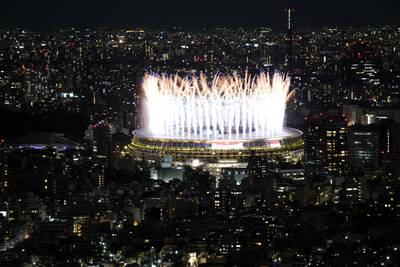 Fireworks illuminate over the National Stadium during the opening ceremony of 2020 Tokyo Olympics.
