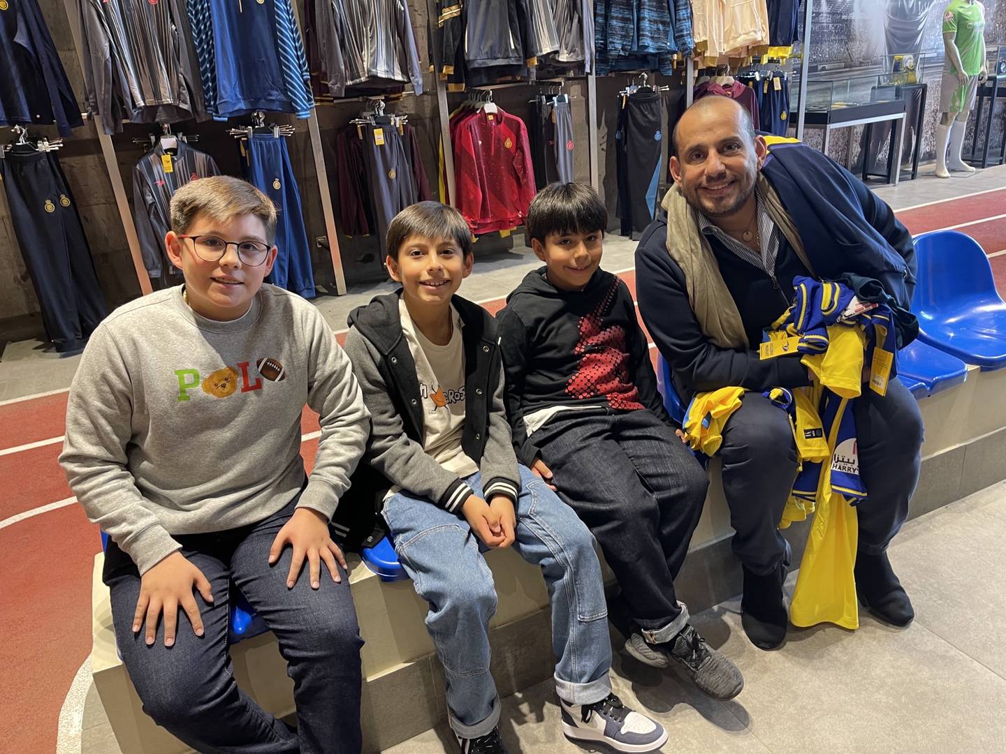 Colombian Carlos Mauricio Rodriguez with his sons at Al Nassr's club shop.