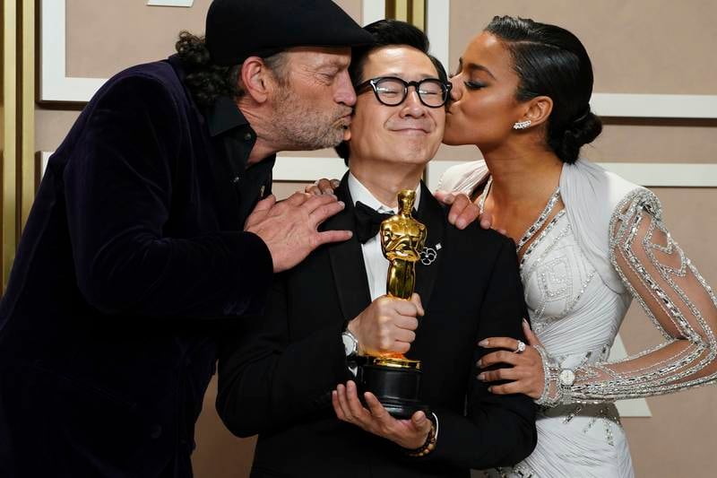 Ke Huy Quan, centre, winner of the award for Best Supporting Actor for Everything Everywhere All At Once with Troy Kotsur, left, and Ariana DeBose. AP