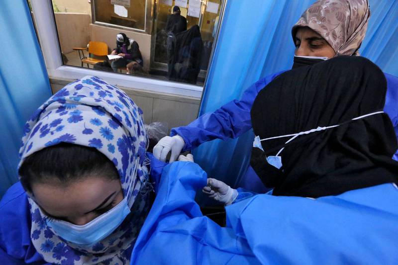 Iraqis get vaccinated against Covid-19 with Chinese Sinopharm vaccine at a private nursing home in Baghdad. AFP
