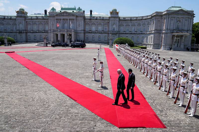 US President Joe Biden and Japanese Prime Minister Fumio Kishida review an honour guard at Akasaka Palace in Tokyo. Reuters