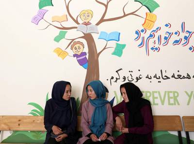 Fatima talks to her classmates as she attends psychotherapy class. Reuters