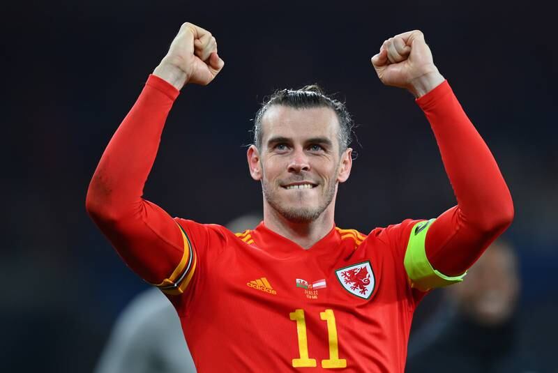 Gareth Bale celebrates after Wales's victory in the 2022 World Cup play-off against Austria at Cardiff City Stadium in March 2022. Getty