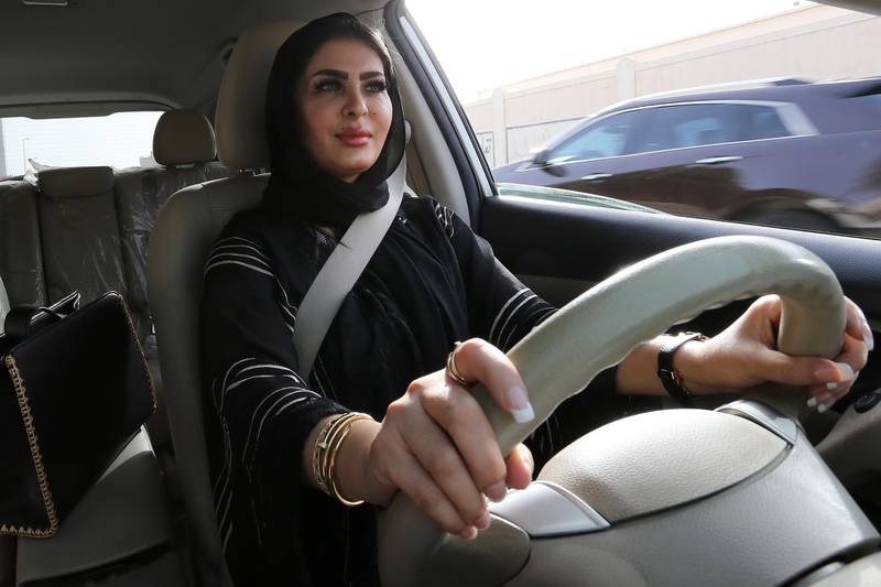 epa06836500 Huda al-Badri, 30, poses behind a steering wheel as women are alowed to drive for the first time through the streets of the capita, Riyadh, Saudi Arabia, in the early morning hours of 24 June 2018 when the royal decree lifted the ban on women driving a car in Saudi Arabia. Women in Saudi Arabia took the wheel early on Sunday after lifting the decades-old ban as part of a liberation campaign in the conservative kingdom.  EPA/AHMED YOSRI