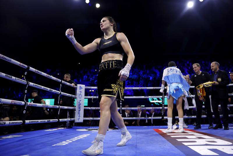 Katie Taylor celebrates after beating Karen Carabajal to win their undisputed lightweight world title fight. PA
