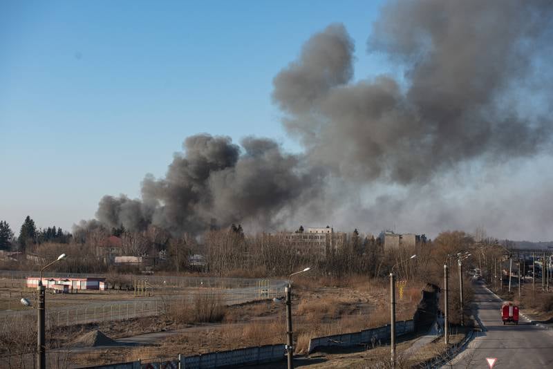 Smoke is seen above buildings close to the airport in Lviv, Ukraine. Lviv's mayor said the airport was not hit, but an area nearby.  Getty Images