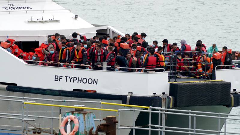 A group of migrants are brought in to Ramsgate, Kent, on August 1 - the day on which almost 700 migrants crossed the Channel to the UK in a single day, a record for the year so far. PA
