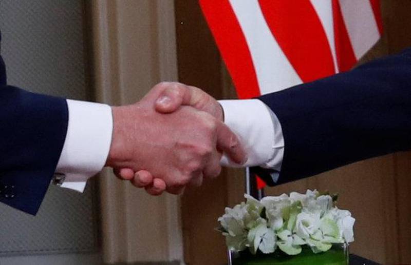 The Trump-Putin handshake. Reuters