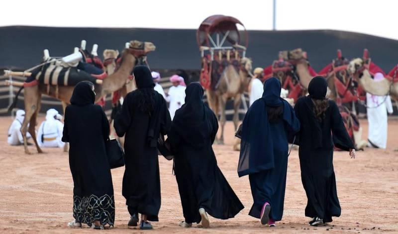 Saudi women attend the first official King Abdulazziz Camel Festival in the village of Al Sayaheed, Rumah, on March 29, 2017. Fayez Nureldine / AFP Photo