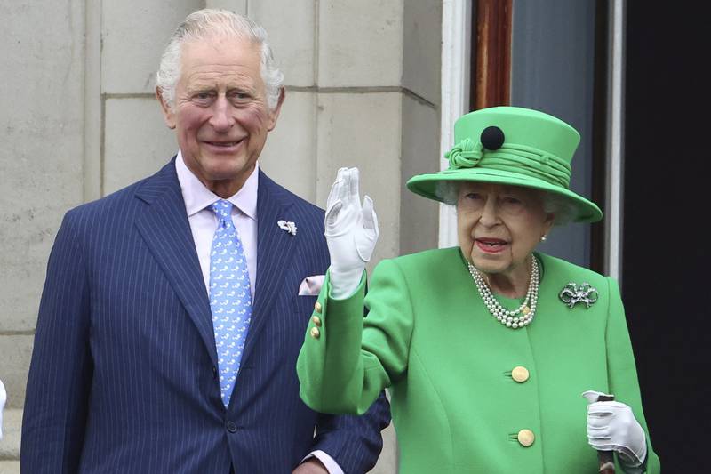 Britain's Queen Elizabeth II, pictured with Prince Charles, says poorer communities are less able to adapt to climate change. AP