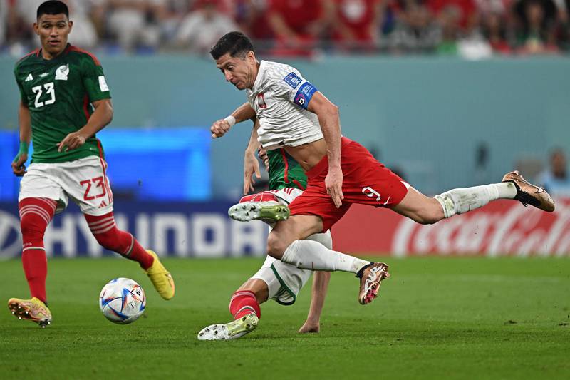 Poland's Robert Lewandowski is fouled by Hector Moreno of Mexico and is awarded a penalty. AFP