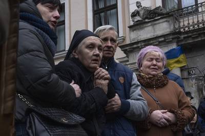 The mother of Lt Oliynyk Dmytro, 40, mourns his death during his funeral ceremony, after the soldier was killed in action, in Lviv, western Ukraine. AP