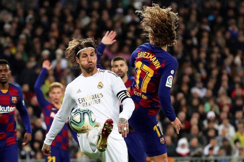 Real Madrid's Sergio Ramos (L) in action against Barcelona's Antoine Griezmann. EPA