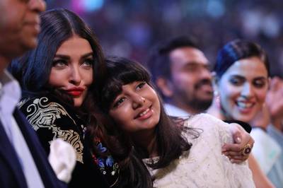 Aishwarya Rai Bachchan and daughter Aaradhya enjoy Abhishek's performance on the front row.