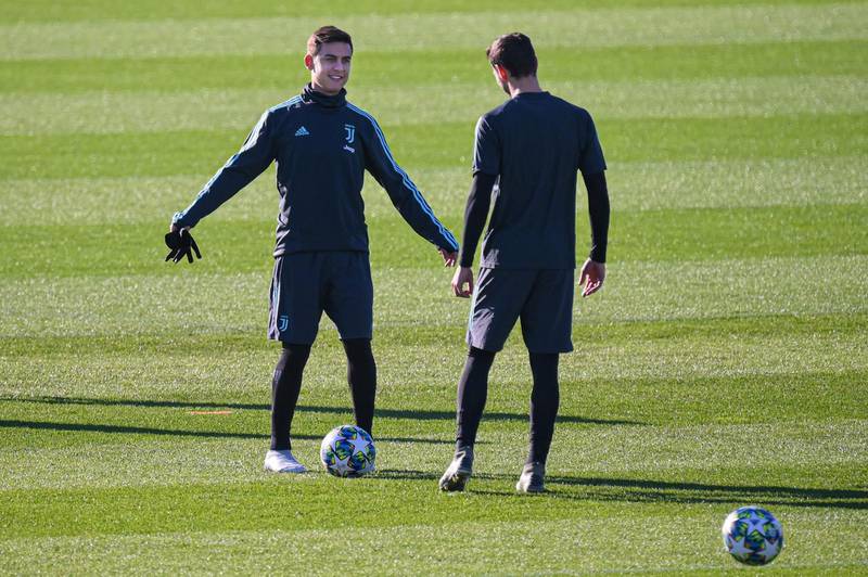Juventus forward Paulo Dybala (L) and defender Mattia De Sciglio. AFP