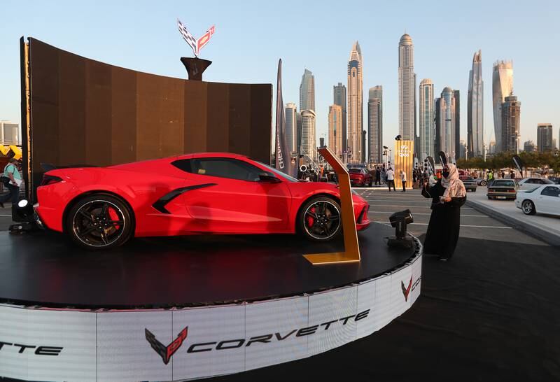 A visitor takes a photo for a new Corvette. EPA