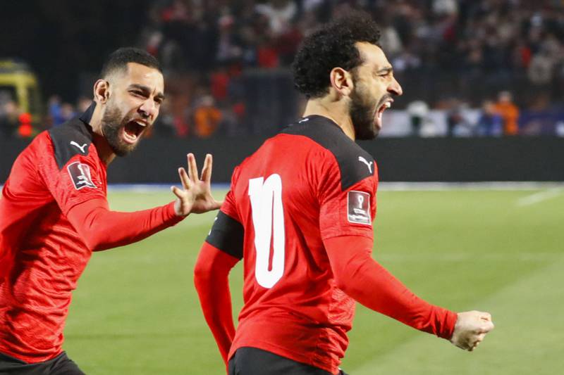 Egypt's forward Mohamed Salah and midfielder Amr el-Solia celebrate the goal against Senegal. AFP