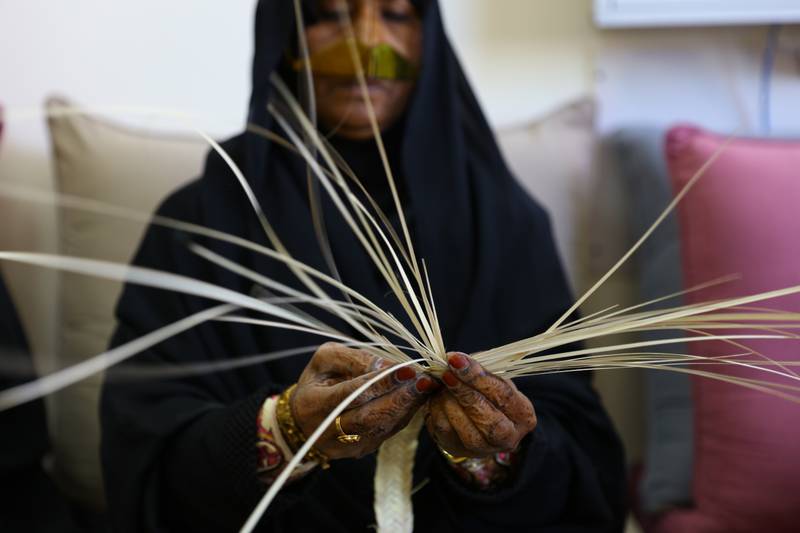 An Irthi artisan weaves straw baskets and mats out of palm fronds. Photo: Irthi Contemporary Crafts Council