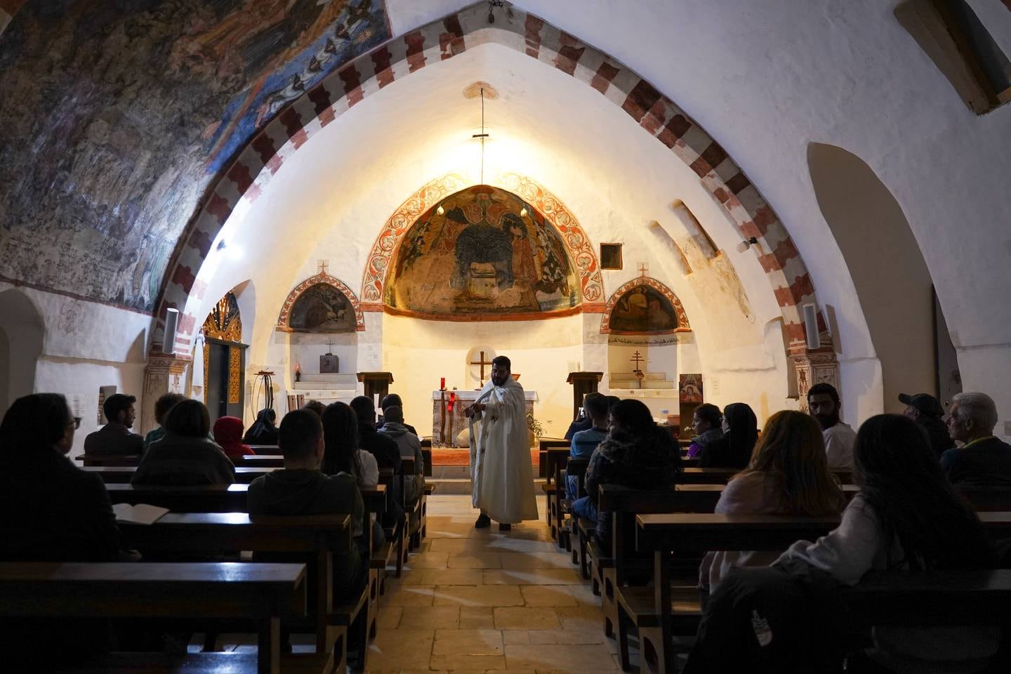 Father Hani Tawk celebrates Mass at the Deir Qannoubine monastery on Maundy Thursday. Photo: Finbar Anderson / The National