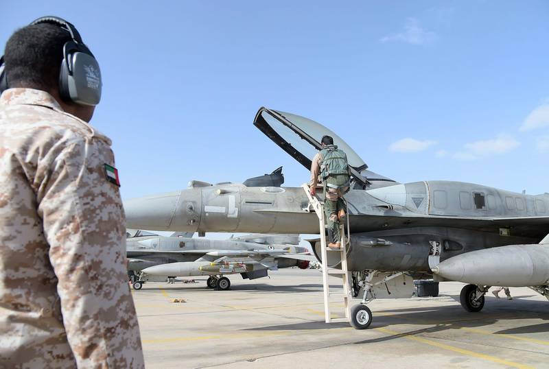 A handout image made available on February 12, 2015 by the United Arab Emirates News Agency (WAM) shows pilots of the UAE armed forces next to aircrafts of the F-16 squadron upon their return at an air force base in Jordan after raids against Islamic State (IS) group's positions. The United Arab Emirates, which is part of the US-led coalition against IS group, resumed on February 10, 2015 air strikes which it had suspended after the jihadists captured a Jordanian pilot in December.  AFP PHOTO/HO/WAM 
== RESTRICTED TO EDITORIAL USE - MANDATORY CREDIT "AFP/HO/WAM" - NO MARKETING NO ADVERTISING CAMPAIGNS - DISTRIBUTED AS A SERVICE TO CLIENTS ==
 *** Local Caption ***  855011-01-08.jpg 855011-01-08.jpg