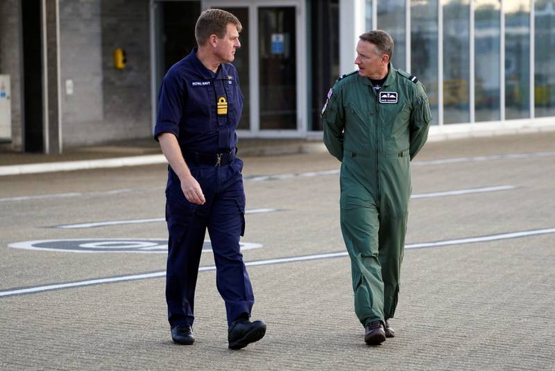 Vice-Admiral Ben Key, who supervised the UK's withdrawal, and Air Mobility Force Commander to Air Commodore David Manning prepare to address the media as members of the British armed forces arrive at RAF Brize Norton. Reuters
