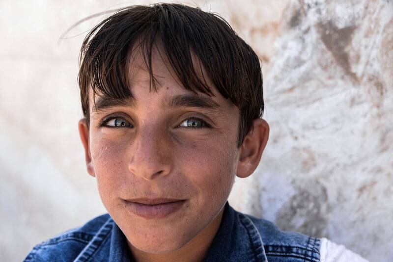 A boy poses for a picture at the Jadaa rehabilitation camp for the displaced near the northern Iraqi city of Mosul.